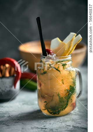 Summer lemonade pear with pepper. Refreshing summer drink with ice. Real concept, cocktail workspace Summer lemonade pear with pepper. Refreshing summer drink with ice. Real concept, cocktail workspace 56640837