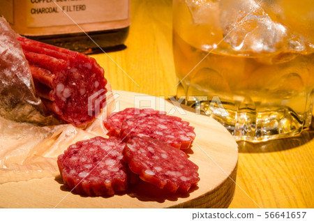 At the bar counter With the lock on the salami bourbon whiskey as a snack At the bar counter With the lock on the salami bourbon whiskey as a snack 56641657
