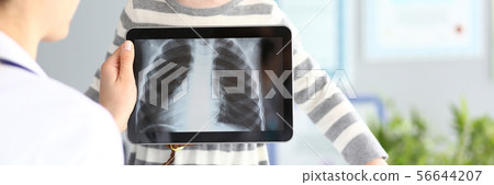 Female doctor examining little girl with ultra modern scanning tablet pc device Female doctor examining little girl with ultra modern scanning tablet pc device 56644207