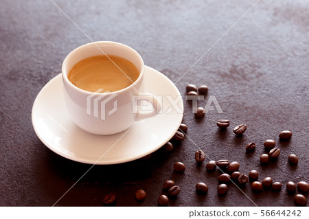 Hot cup of espresso coffee on a table 56644242