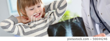 Female paediatrician working with cute little girl at her office explaining diagnosis Female paediatrician working with cute little girl at her office explaining diagnosis 56644246