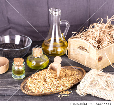 The Sesame oil in glass and seeds 56645353