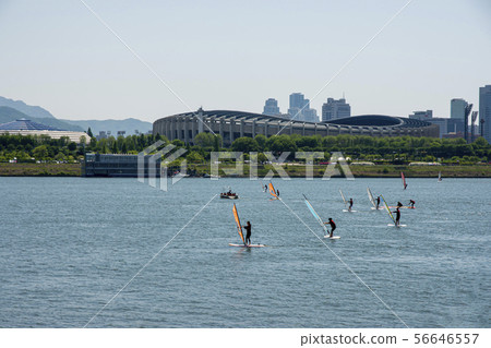 People enjoying windsurfing 56646557