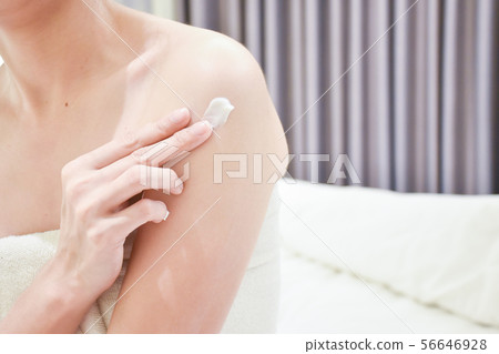 Woman applying arm cream,lotion . 56646928