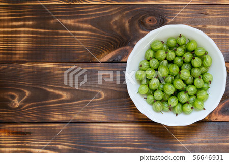 Green gooseberries on wooden background with copy space. Top view. 56646931
