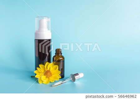 Essential oil in small open brown dropper bottle 56646962