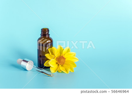 Essential oil in open brown dropper bottle with 56646964