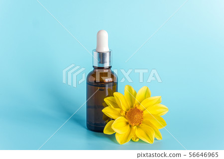 Essential oil in brown dropper bottle and yellow 56646965