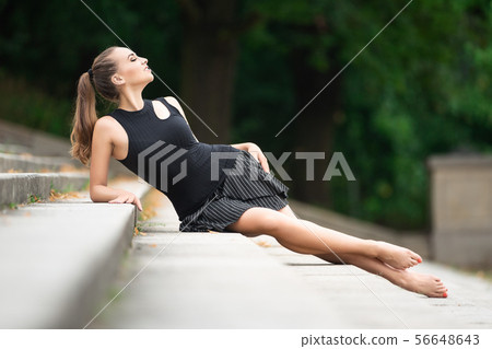 Beautiful woman with shapely long legs 56648643