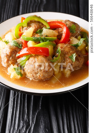 Tasty meatballs with pineapples and vegetables in 56648646