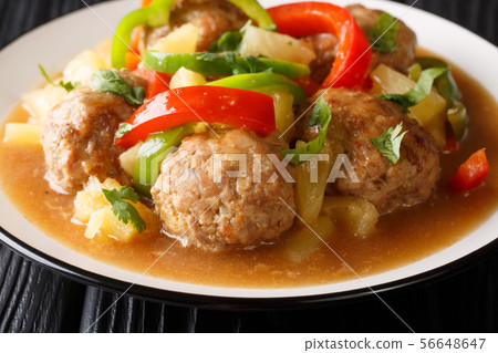 Serving of meatballs with fresh pineapples and 56648647