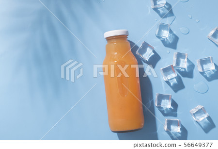 Detox cocktail of fresh fruits and vegetables on blue background 56649377