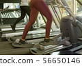 People running on treadmill 56650146