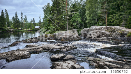 Wooden house on a mountain river. Scenic view Wooden house on a mountain river. Scenic view 56650762