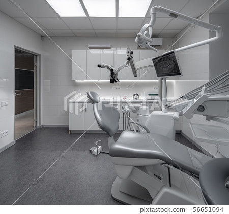 Contemporary dental clinic with light interior and hi-tech equipment Contemporary dental clinic with light interior and hi-tech equipment 56651094