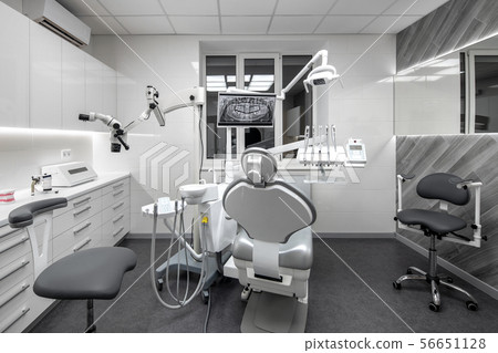 Contemporary dental clinic with light interior and hi-tech equipment 56651128