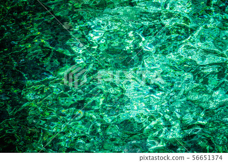 Blue emerald water rippled background 56651374