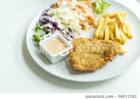 Fried fish steak on white 56651393
