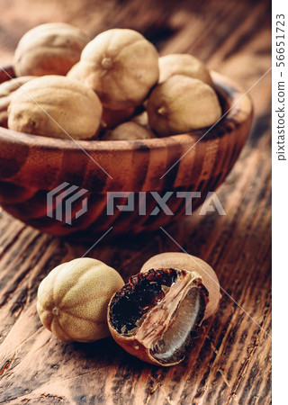 Dried limes on wooden table Dried limes on wooden table 56651723