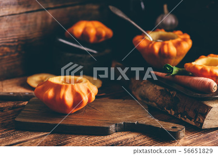 Preparing yellow pattypan squash for stuffing Preparing yellow pattypan squash for stuffing 56651829