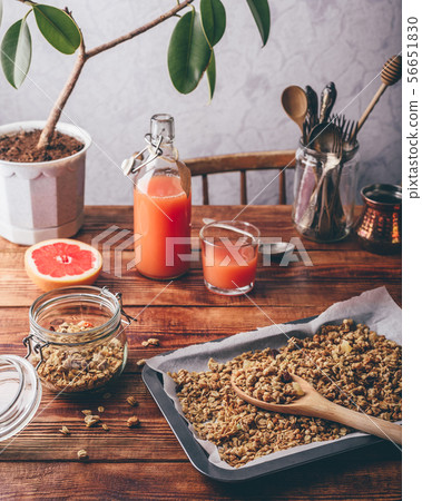 Freshly prepared granola and grapefruit juice for 56651830
