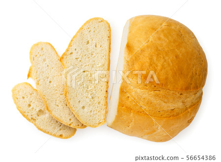 Loaf of bread cut into pieces on a white. The view Loaf of bread cut into pieces on a white. The view 56654386