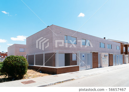 Exterior view of modern townhouses with brick 56657467