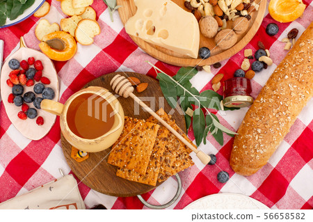 Stylish picnic on the green lawn. Fresh croissants Stylish picnic on the green lawn. Fresh croissants 56658582