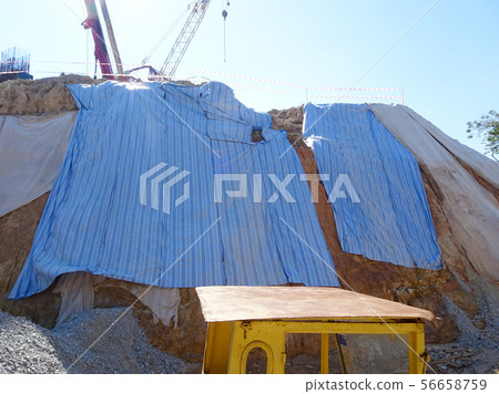 Temporary slope protection using plastic sheets Temporary slope protection using plastic sheets 56658759