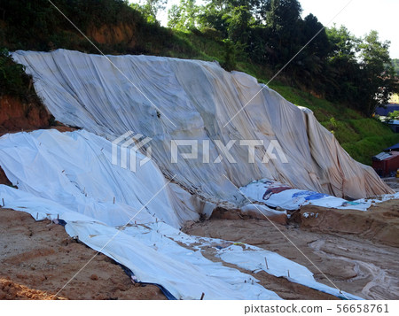Temporary slope protection using plastic sheets Temporary slope protection using plastic sheets 56658761