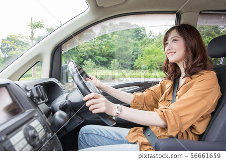Young woman driving Young woman driving 56661659