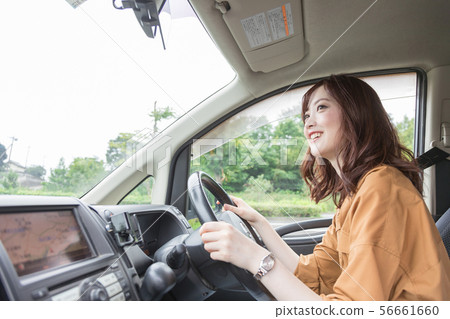 Young woman driving 56661660