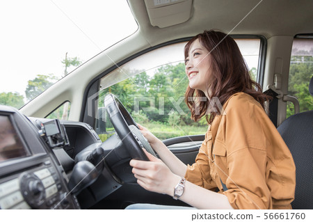 Young woman driving 56661760