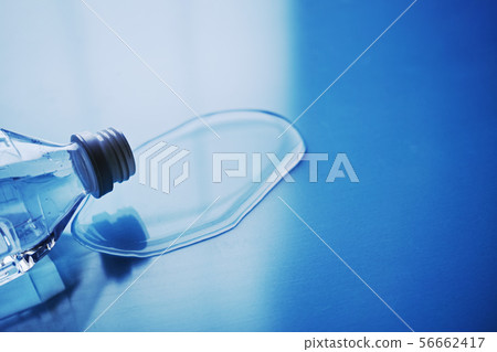 Water spilled from a fallen plastic bottle 56662417