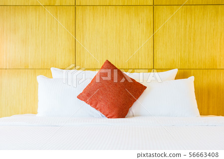 White comfortable pillow on bed decoration White comfortable pillow on bed decoration 56663408
