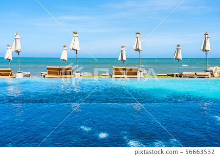 Beautiful outdoor nature landscape with bed deck chair around swimming pool in hotel resort Beautiful outdoor nature landscape with bed deck chair around swimming pool in hotel resort 56663532
