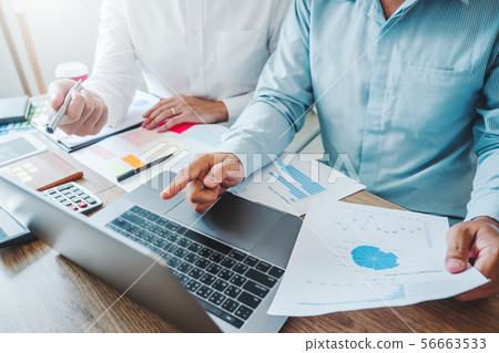 Multiracial creative team working together in Multiracial creative team working together in 56663533