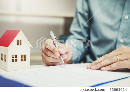 Business man calculated cost and sign agreement 56663614