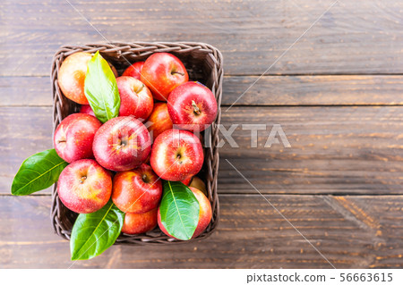 Red apple in basket 56663615