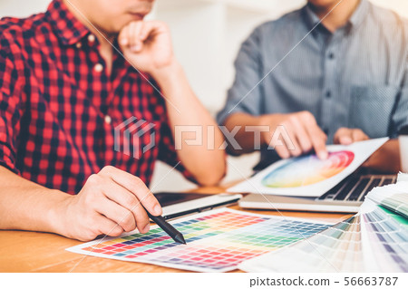 Two Graphic designer Brainstorming Meeting and Two Graphic designer Brainstorming Meeting and 56663787