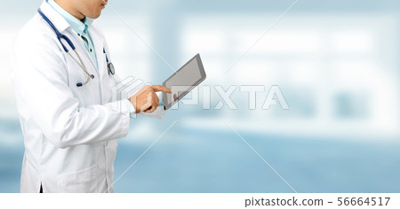 Doctor with tablet computer at hospital. Doctor with tablet computer at hospital. 56664517