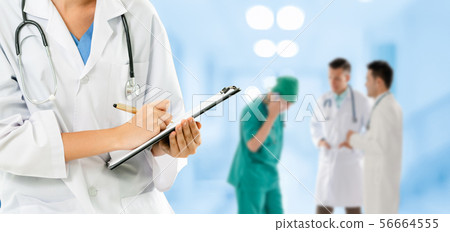 Doctor working in hospital with other doctors. Doctor working in hospital with other doctors. 56664555