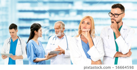 Doctor working in hospital with other doctors. Doctor working in hospital with other doctors. 56664598