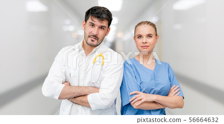 Doctors at hospital working with another doctor. Doctors at hospital working with another doctor. 56664632