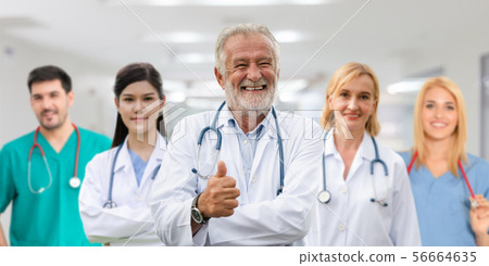 Doctor working in hospital with other doctors. Doctor working in hospital with other doctors. 56664635