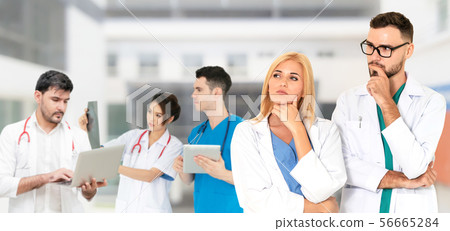 Doctor working in hospital with other doctors. Doctor working in hospital with other doctors. 56665284