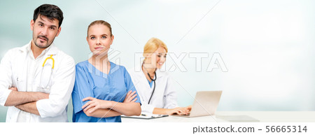 Doctor working in hospital with other doctors. 56665314