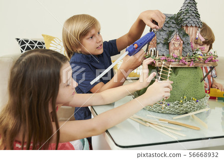 Children working on fairytale castle 56668932