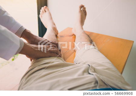 Physiotherapists are using the hands to grip the 56669908