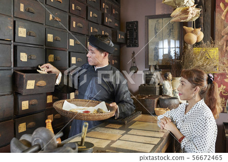 Apothecary worker collecting order Apothecary worker collecting order 56672465